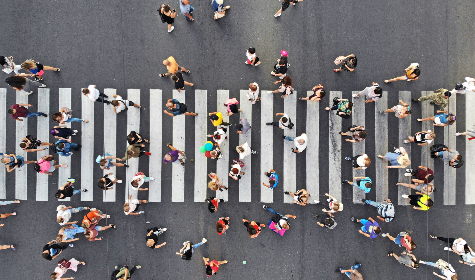 aerial.,people,crowd,on,pedestrian,crosswalk.,top,view,from,drone.