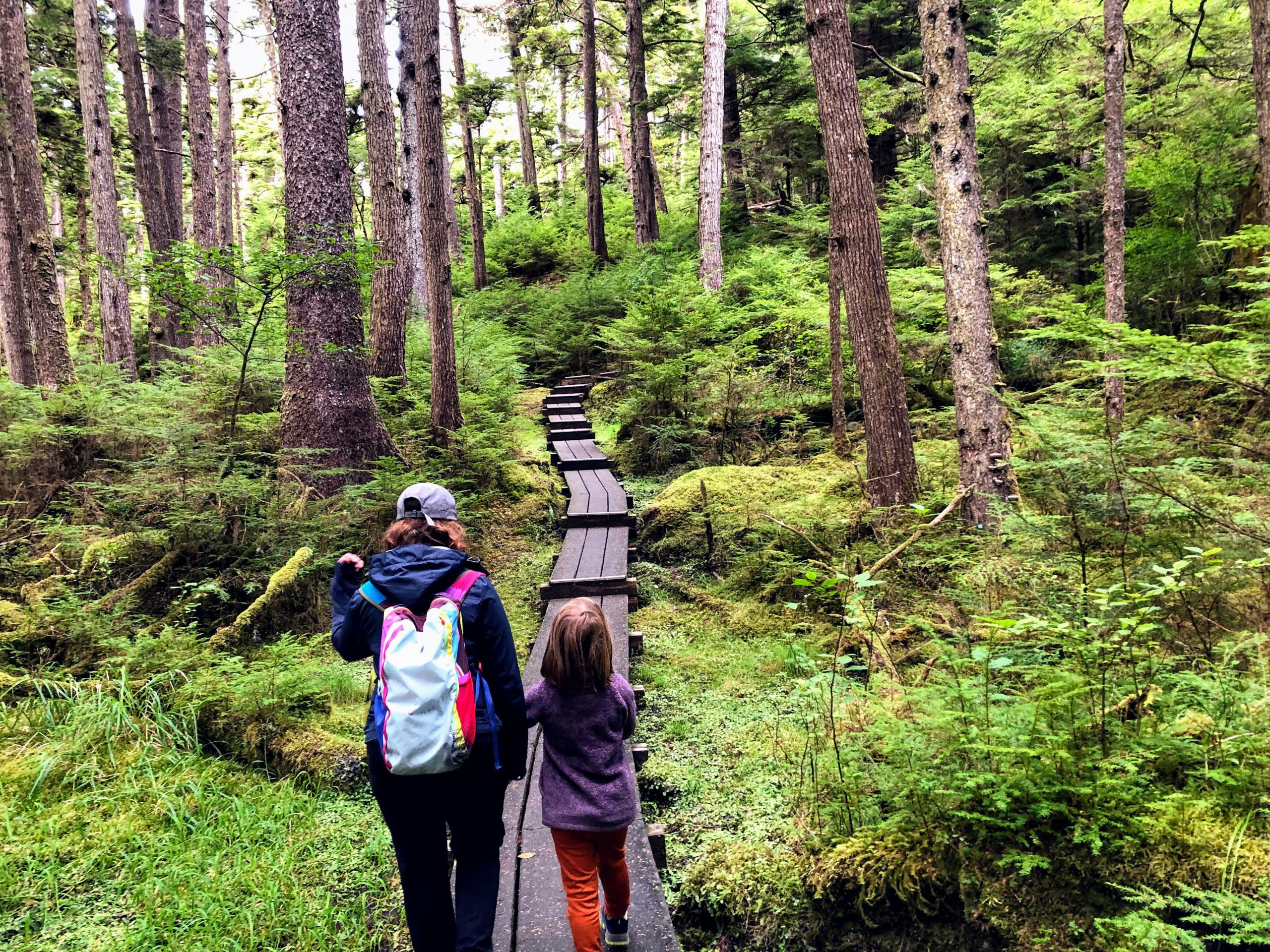 A Mother And Daughter Walking Together Side By Side Exploring The Beautiful Forests Of Tow Hill,