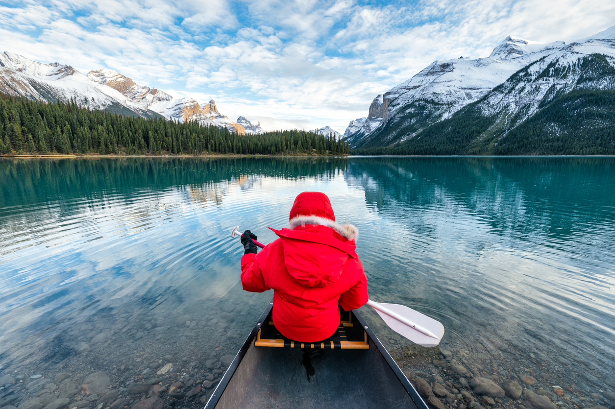 Male Tourist Canoeing In Spirit Island On Maligne Lake At Jasper National Park, Canada